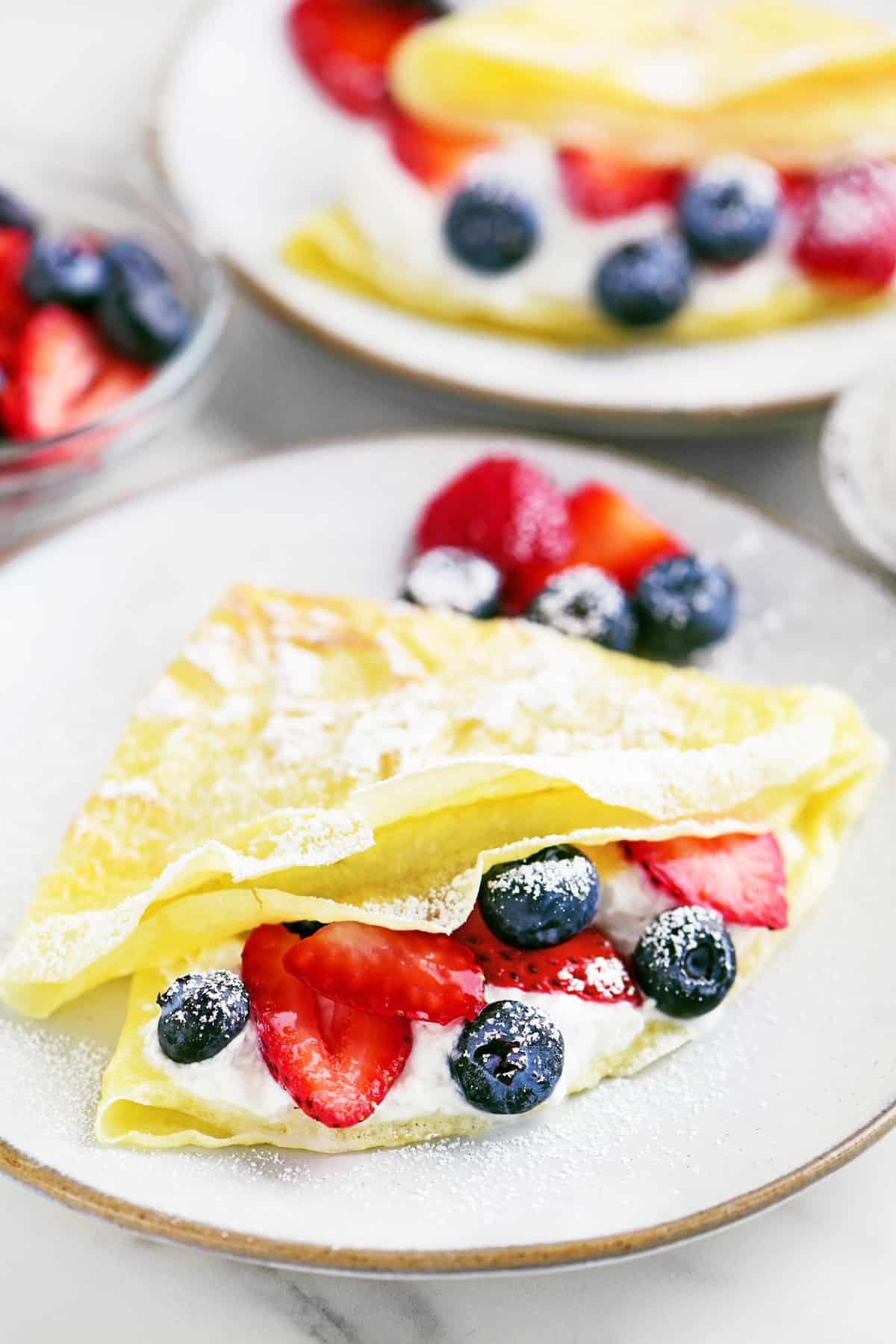 Bisquick crepes with berries and whipped cream.