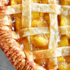 Fresh peach pie with a lattice top.
