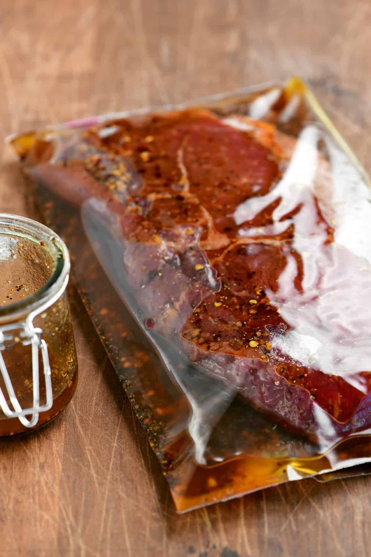 Steak marinating in a plastic bag