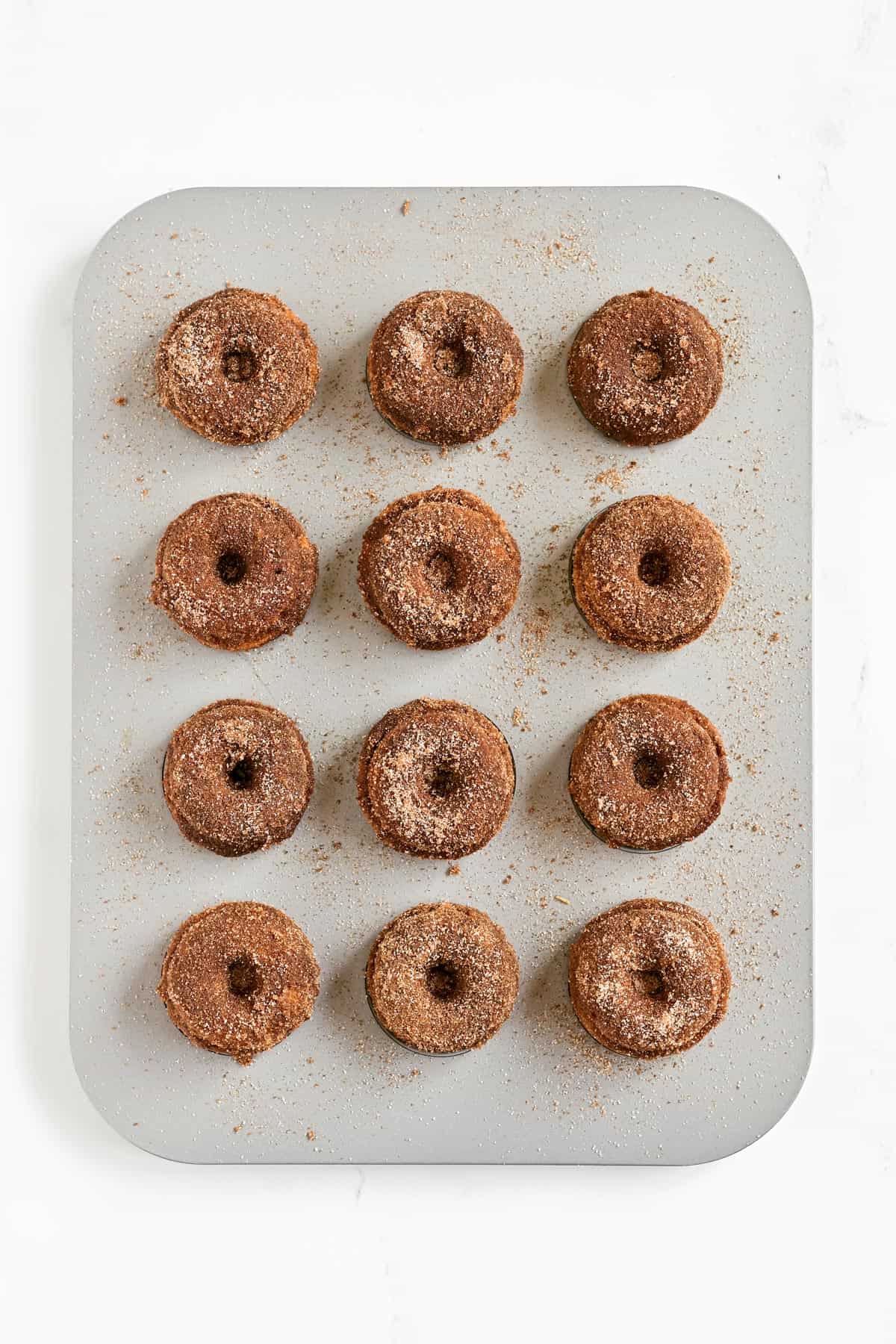 Apple cider mini donuts in a pan.