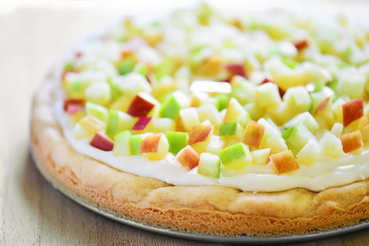 Caramel apple pizza dessert on a platter.