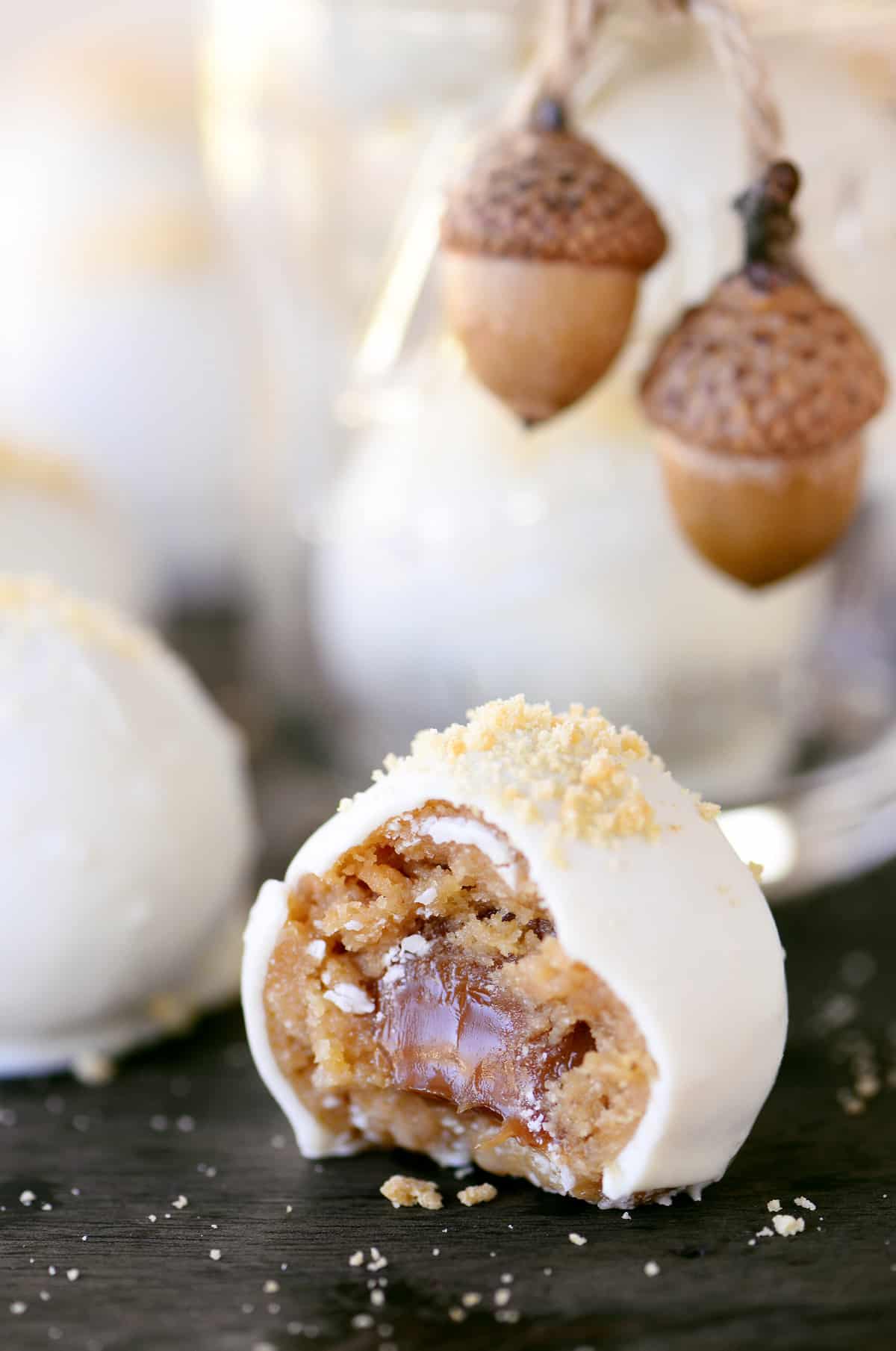 Caramel truffles with white chocolate on top.