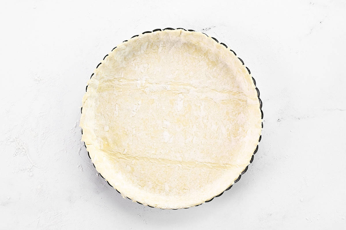 Puff pastry in a tart pan.