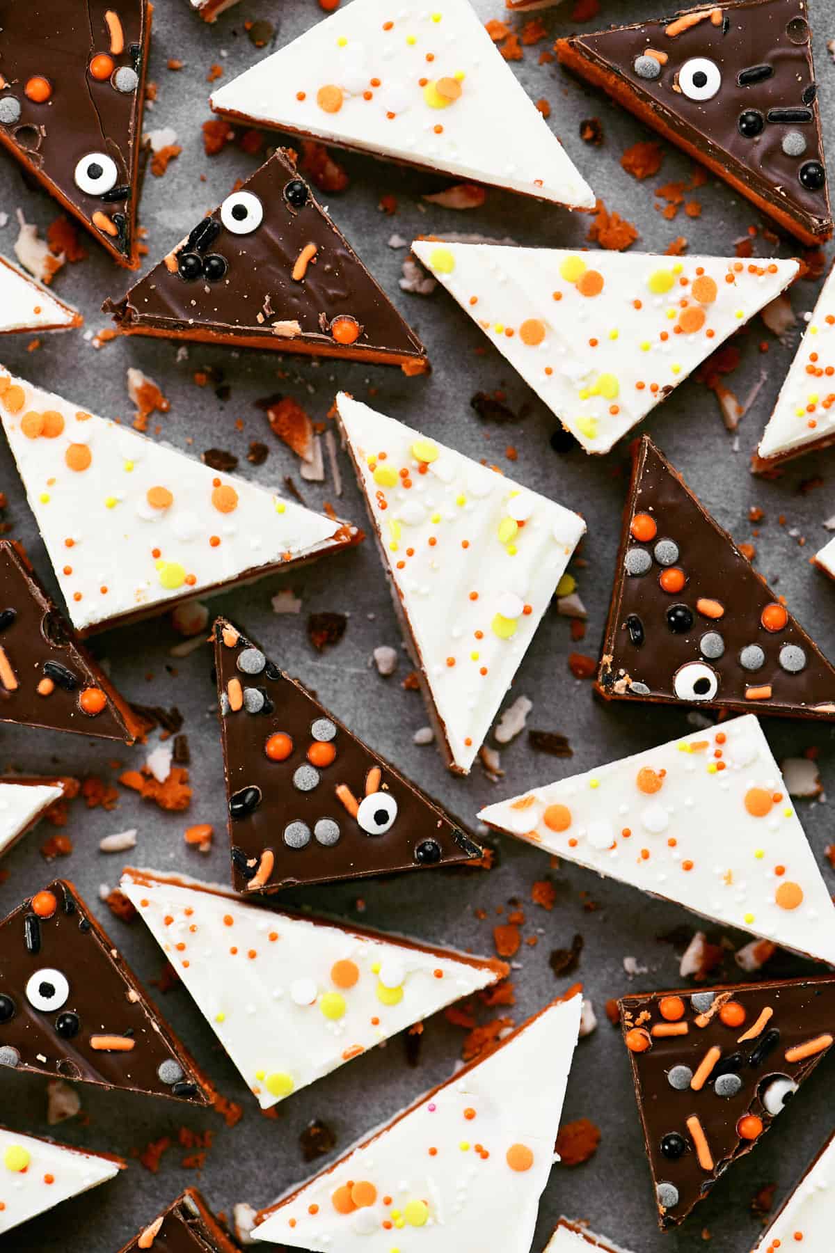 Pieces of candy corn truffle bark with sprinkles on top.