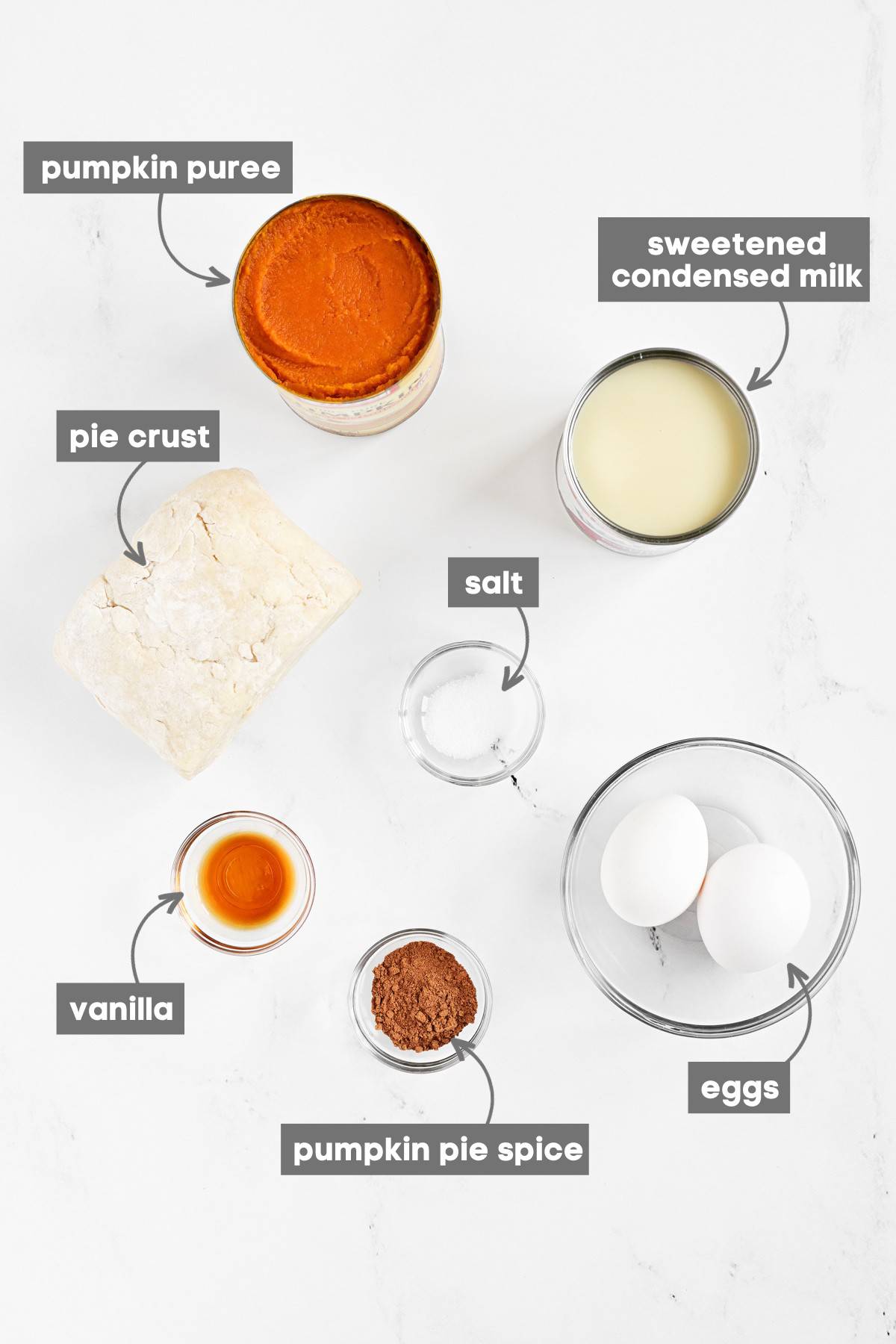 Labeled ingredients on a white marble countertop.