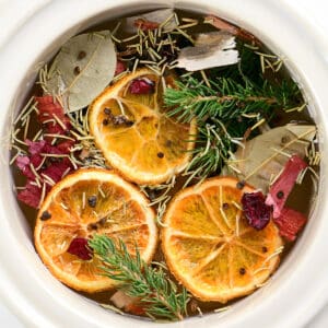 Simmering pot with fruit and spices.
