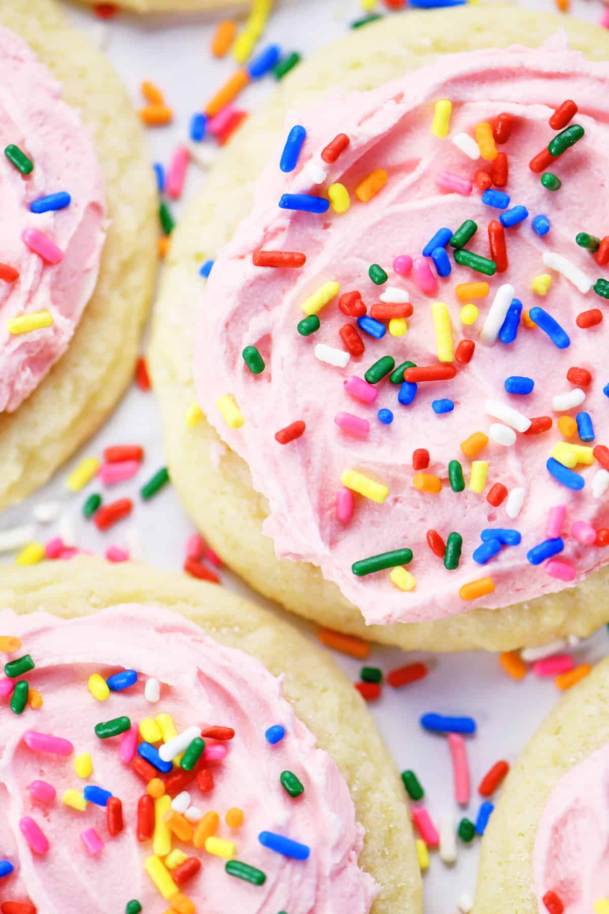 Sugar cookies with buttercream frosting and sprinkles.