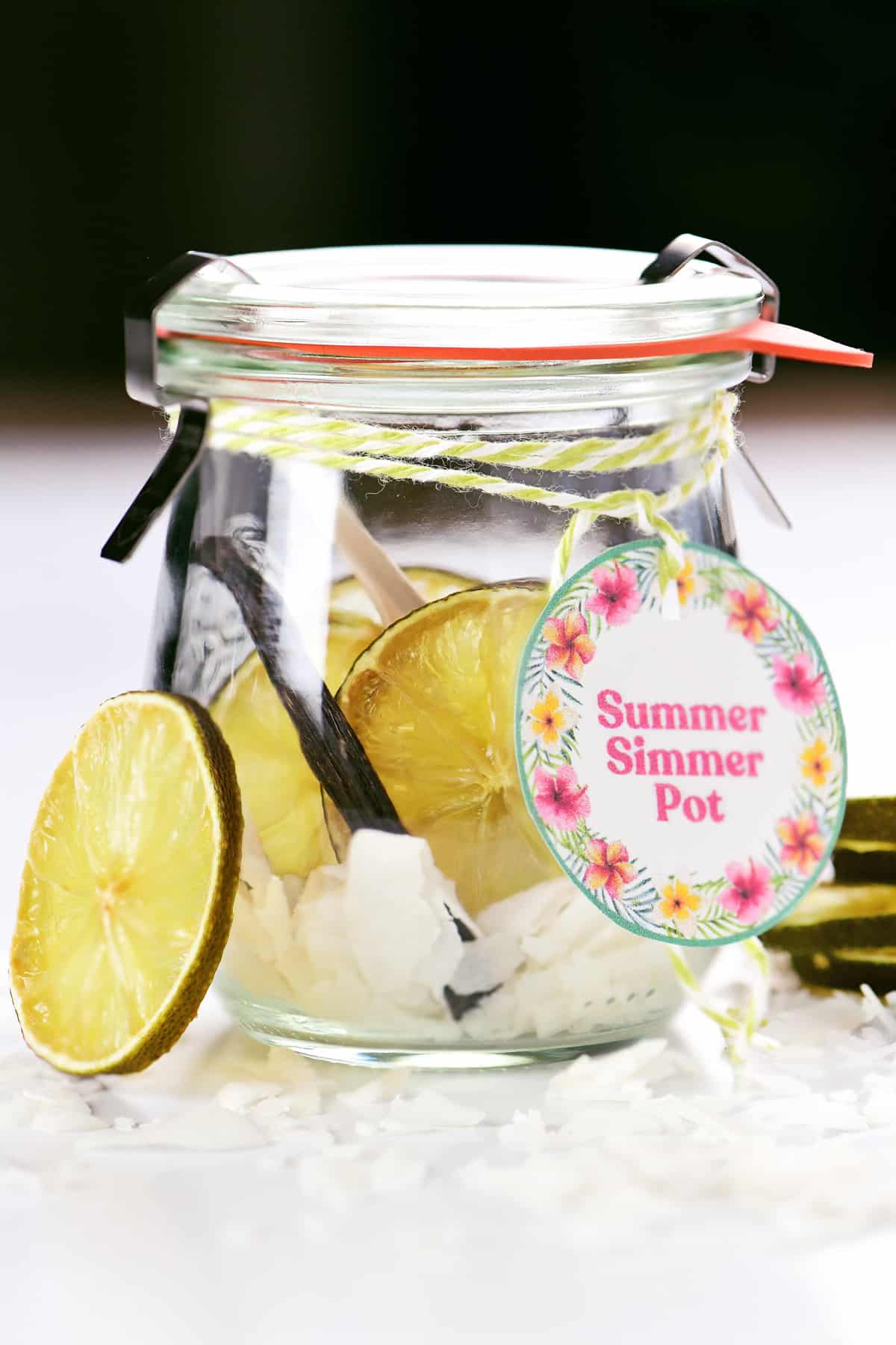 Limes, coconut and vanilla in a labeled jar.