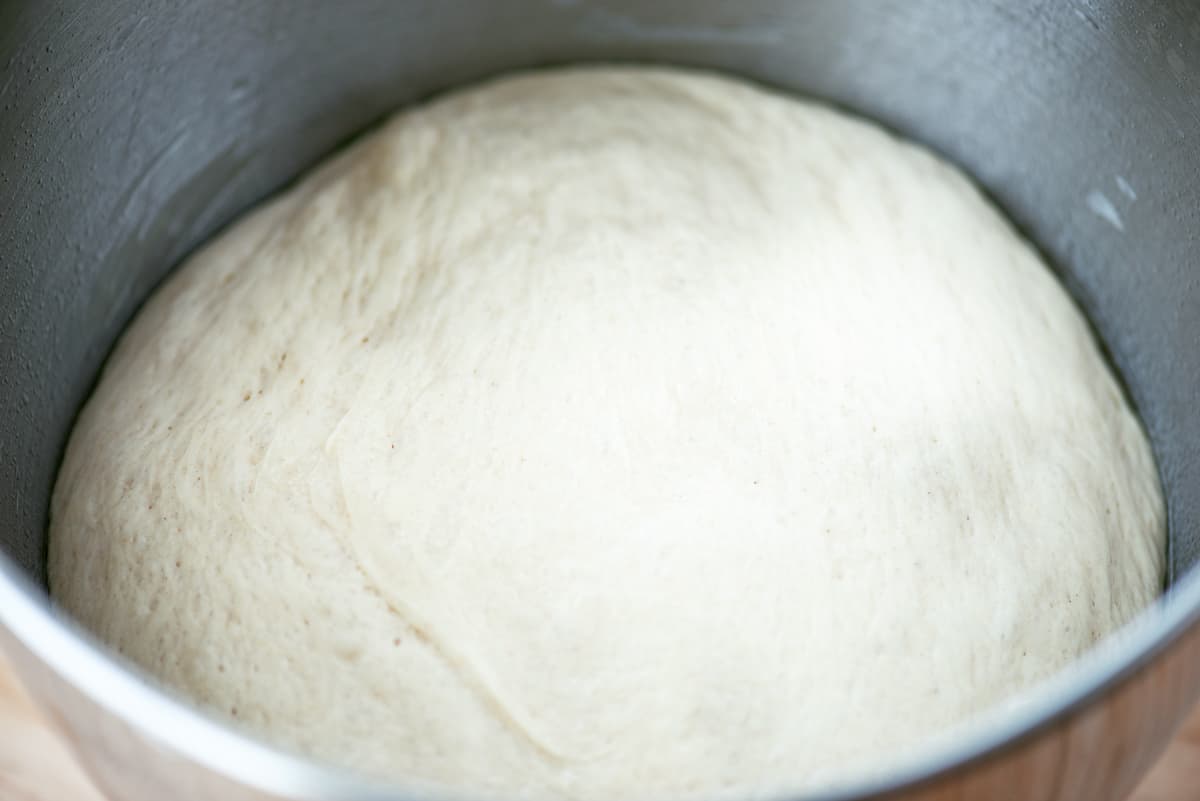 Bread dough in a mixing bowl.