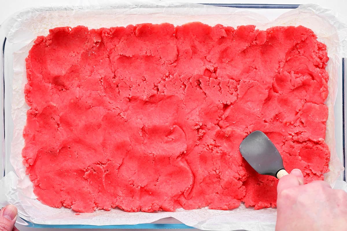 Pink cake mix in pan.