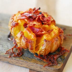 Bloomin' baked potato with cheese and bacon.