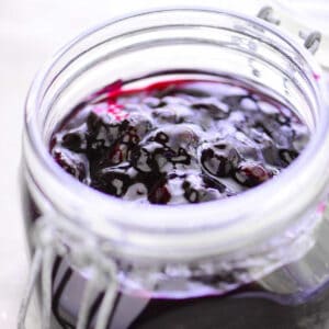Blueberry sauce in a glass jar.