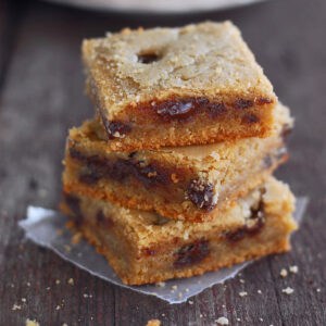Brown butter chocolate chip cookie bars in a stack.