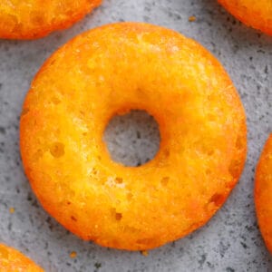 Cheese donuts on a metal pan.