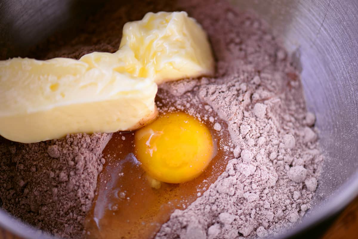 Cake mix, egg, and butter in a mixing bowl.