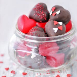 Chocolate cherry juju hearts in a mason jar.