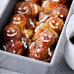 A pan with french toast gingerbread men inside.