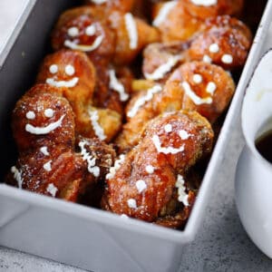 A pan with french toast gingerbread men inside.