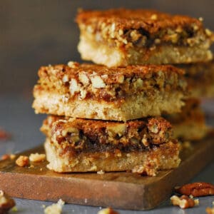 Pecan pie bars in a stack.