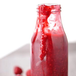 Raspberry sauce in a jar.