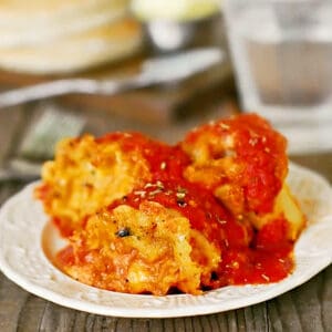 Slow cooker lasagna rolls on a white plate.