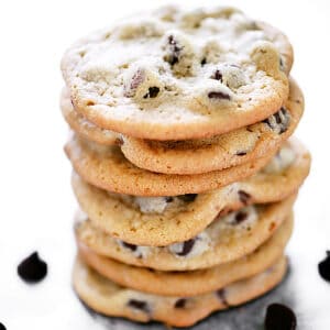 A stack of seven chocolate chip cookies.