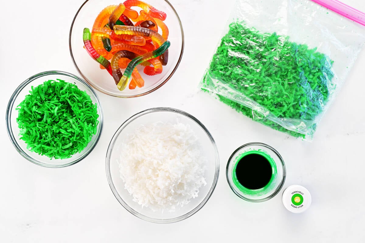 Green coconut, gummy worms, shredded coconut, and food coloring.