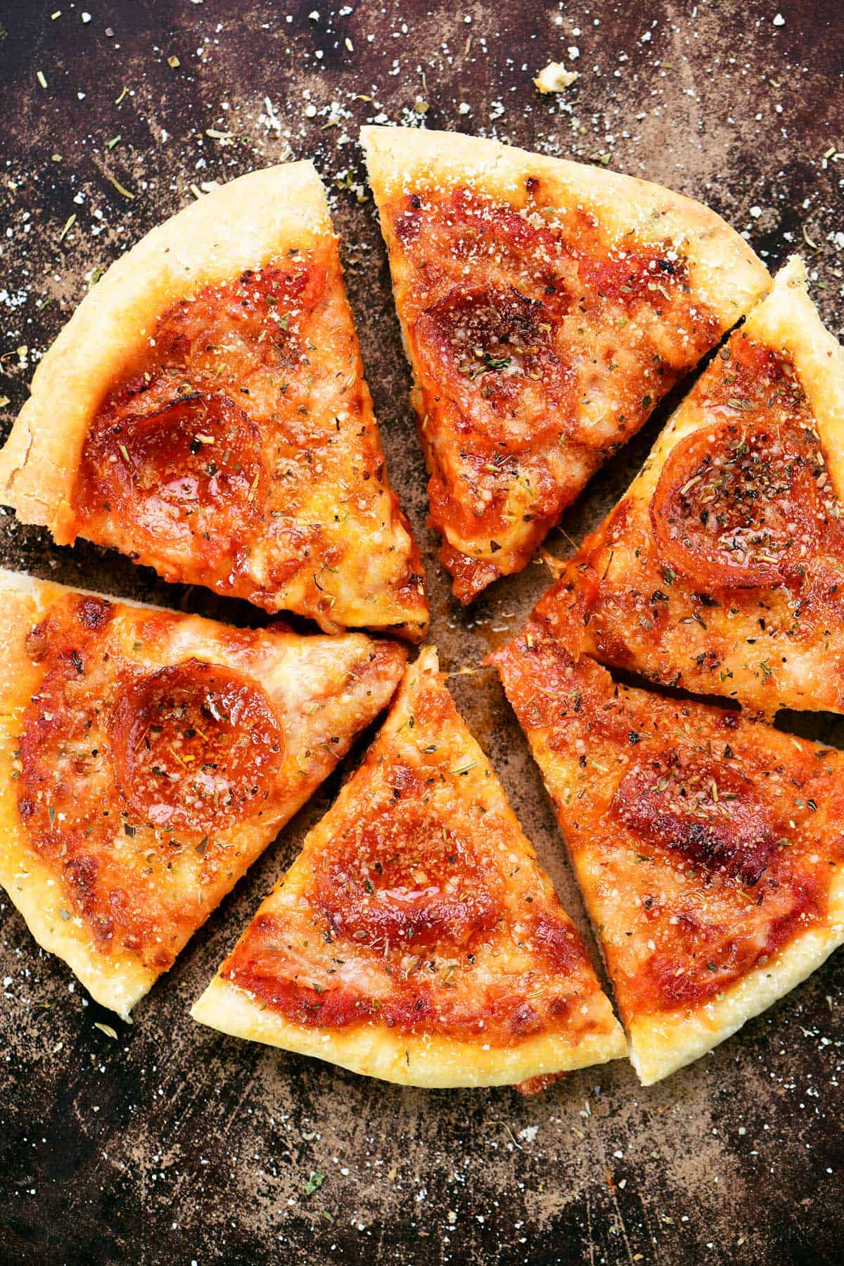 Homemade air fryer pizza cut into six slices.