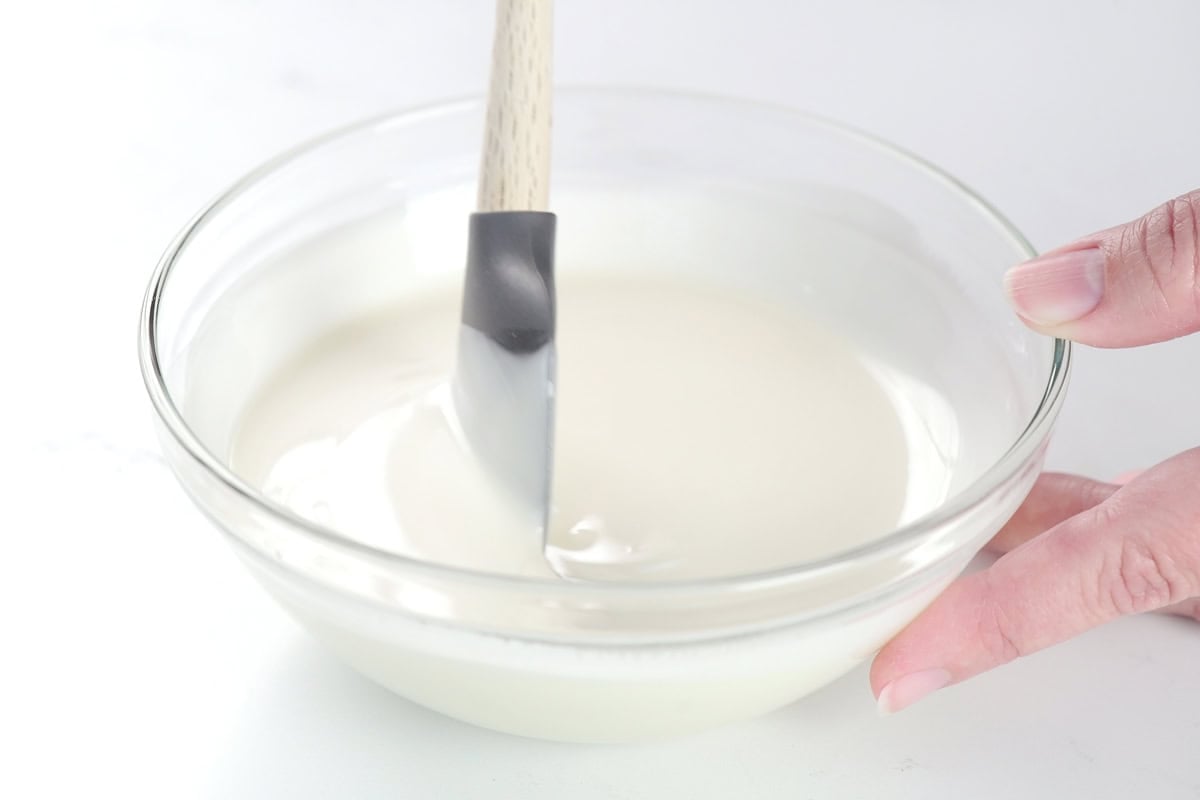 Stirring the ingredients in a bowl.