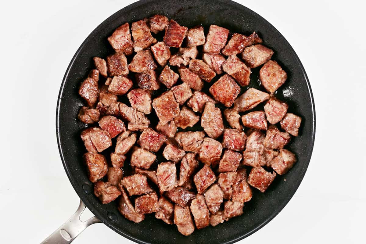 Browed cubes of beef stew meat in a skillet.