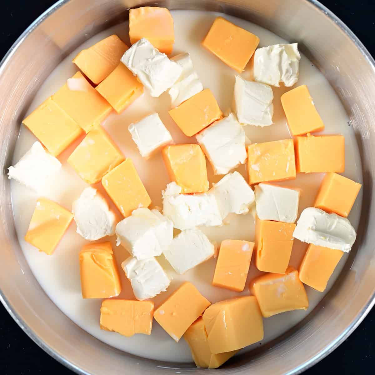 Cheeses in a large pot.