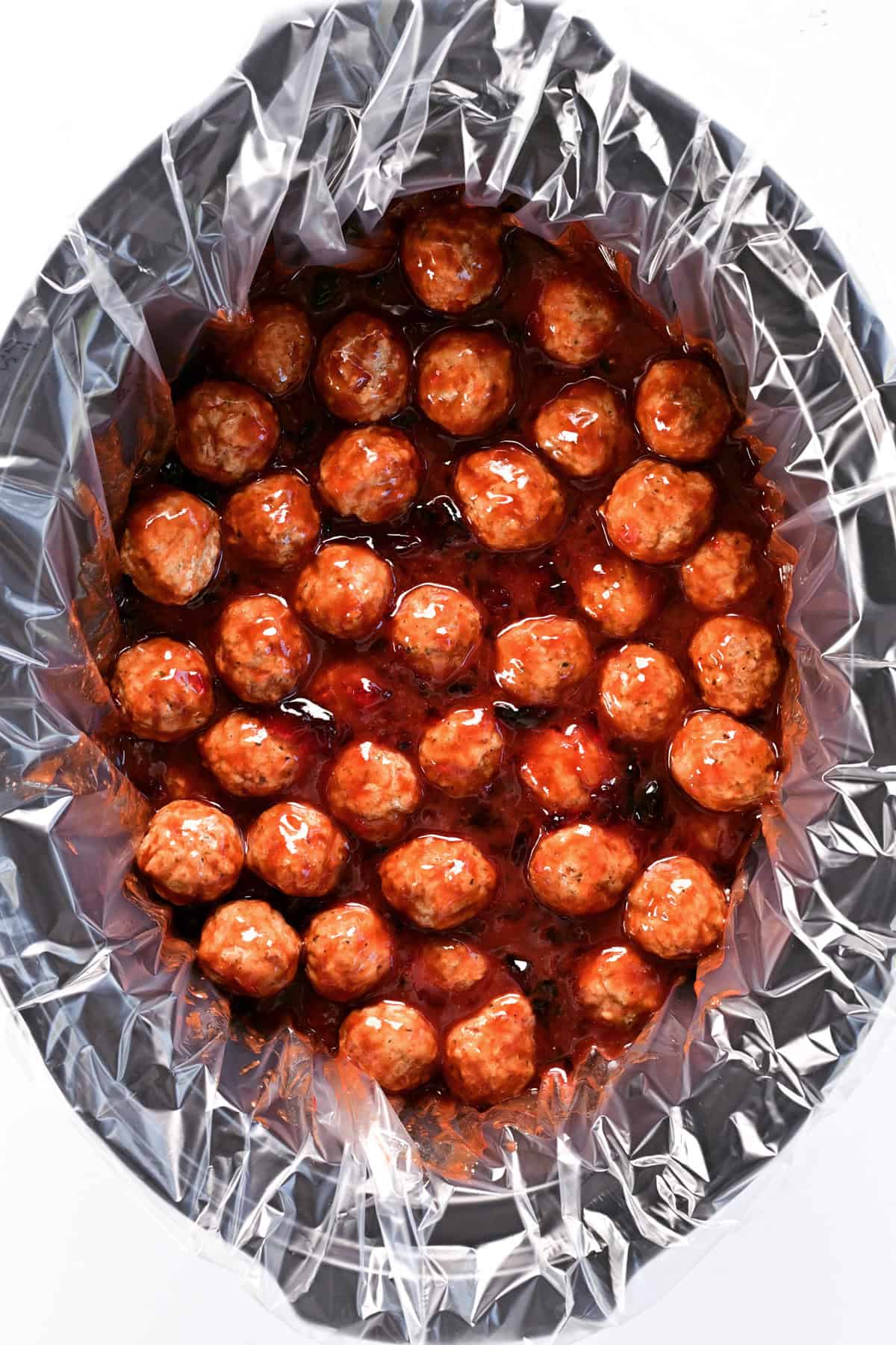 Crockpot with grape jelly meatballs.