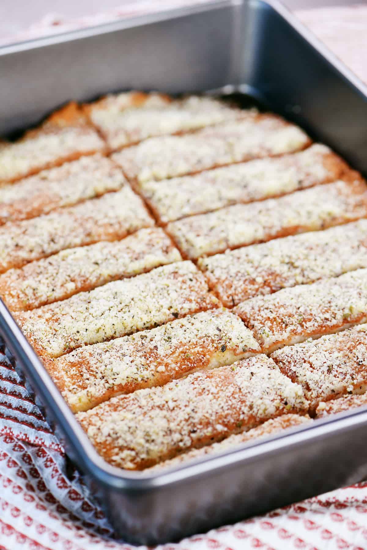 Copycat Pizza Hut breadsticks in a 9x13 inch metal pan.