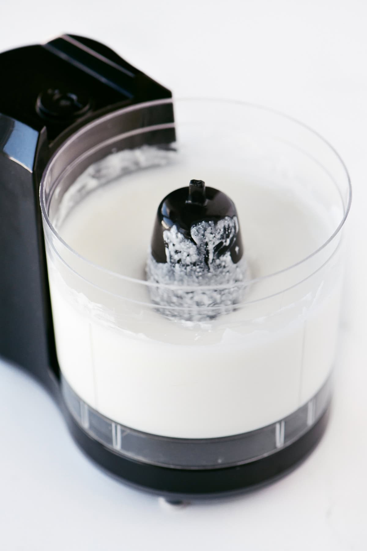 Blended cottage cheese in a mini food processor.