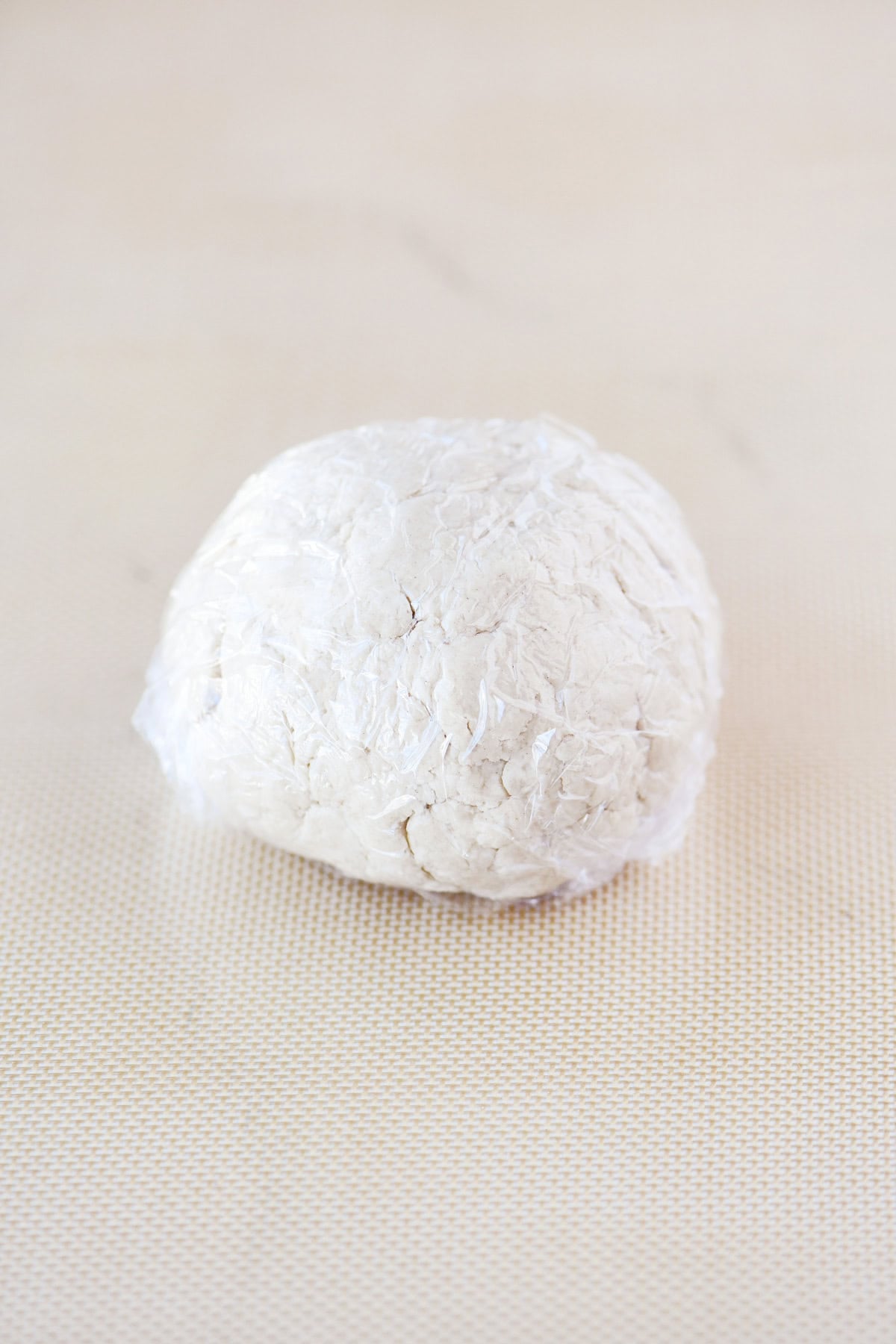A wrapped ball of cottage cheese dough.