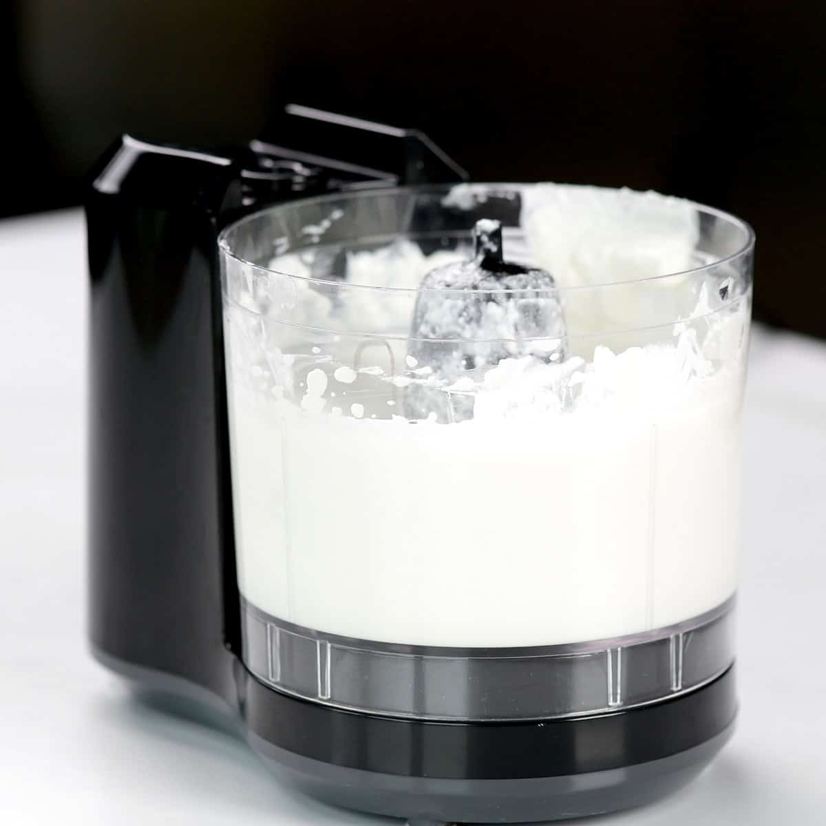 A mini food chopped with blended cottage cheese.