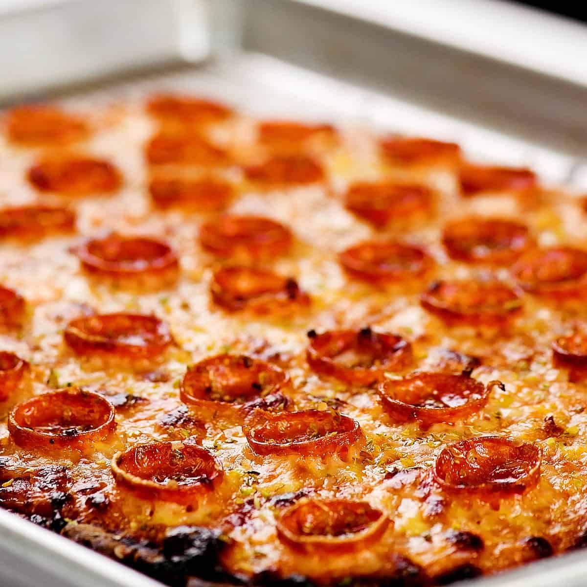 Baked cottage cheese pizza on the pan.