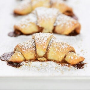 Cottage cheese cinnamon crescent rolls with powdered sugar on top.