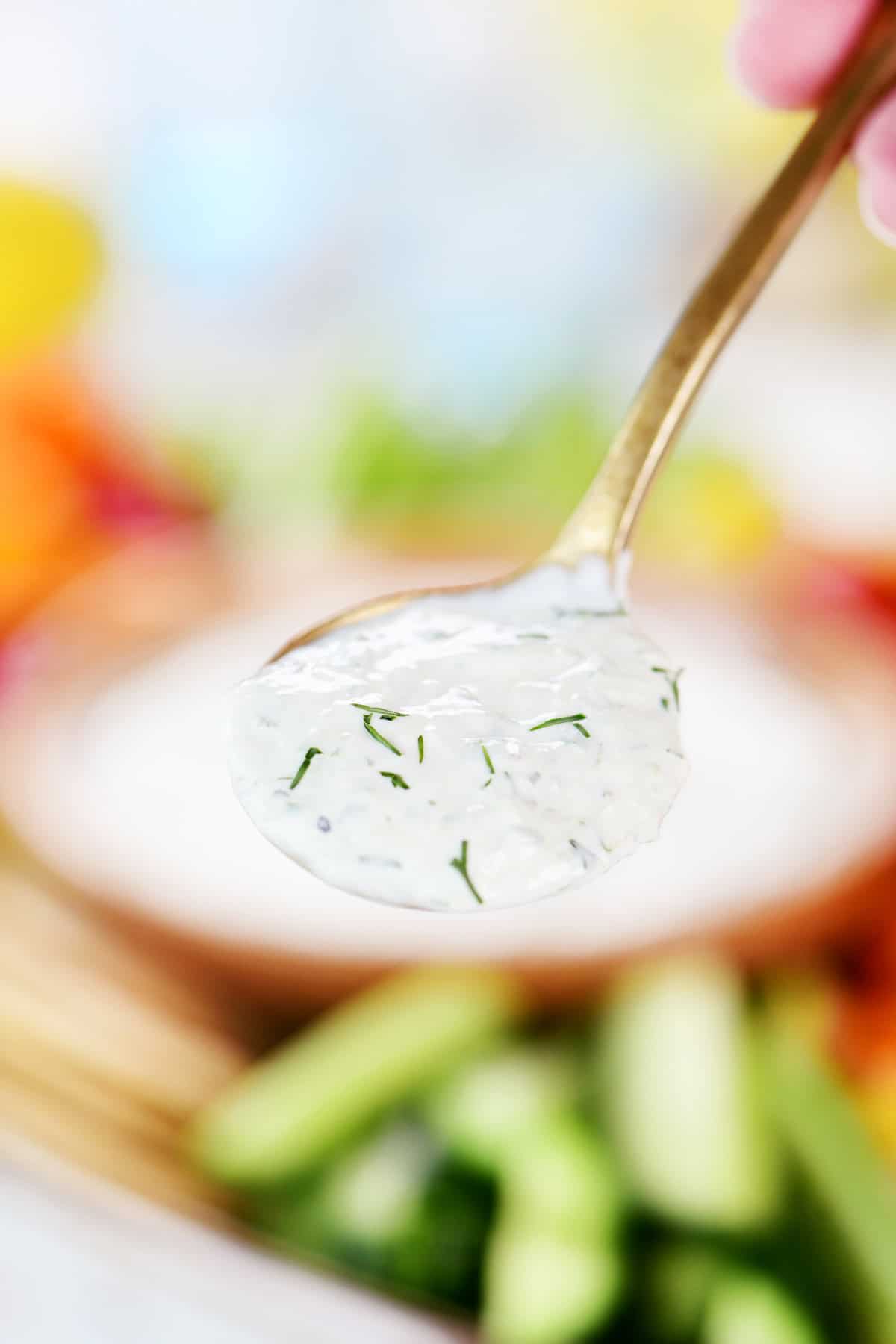 A spoonful of cucumber dill sauce.