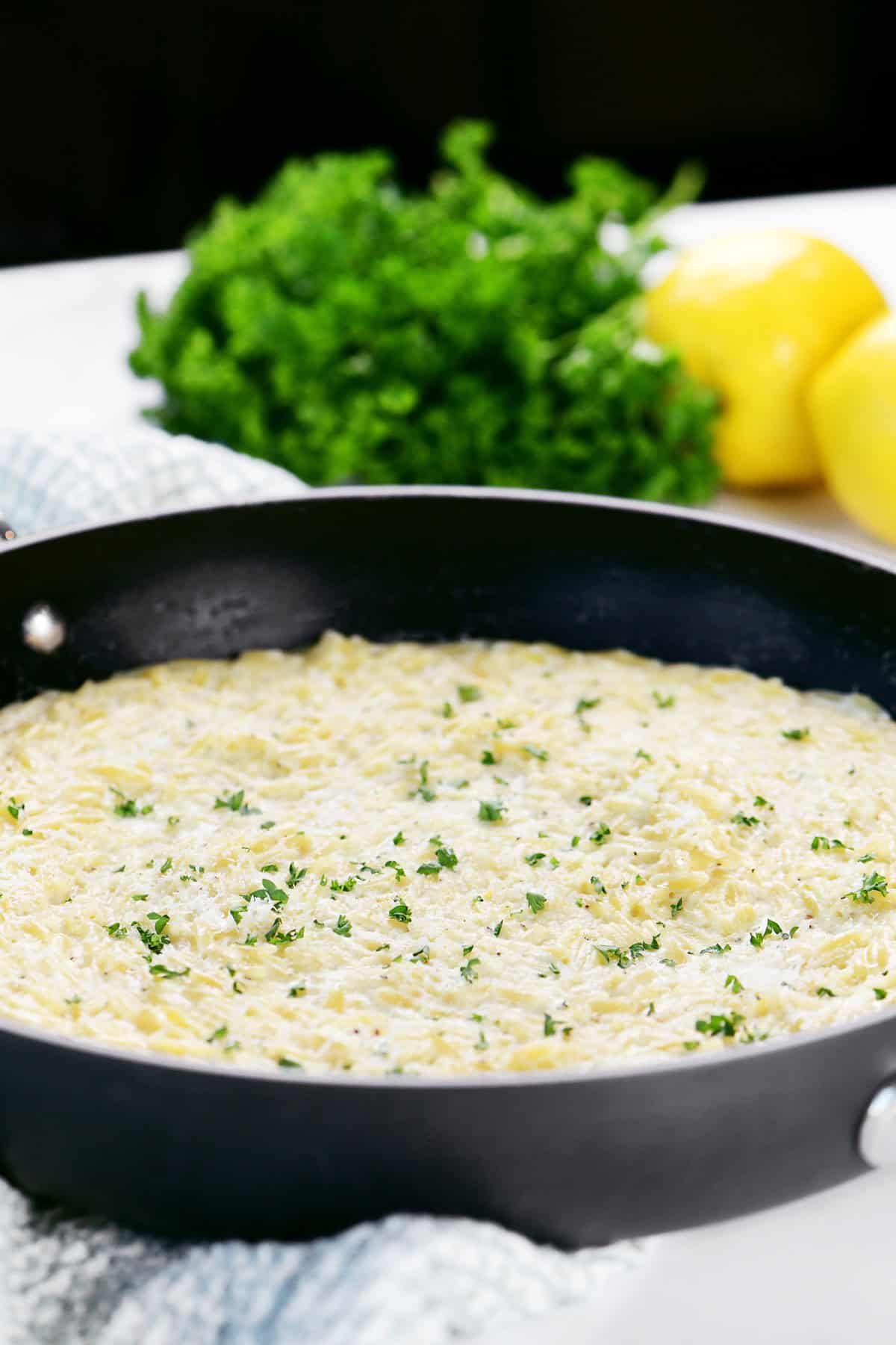 Lemon orzo in a skillet.