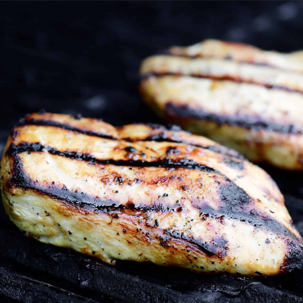 Cooking chicken on the grill.