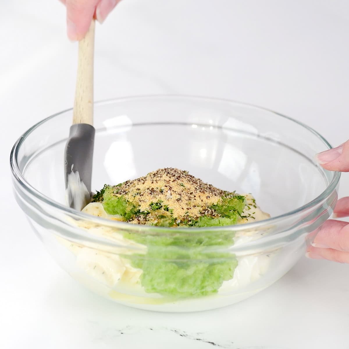 Stirring ingredients in a small bowl.