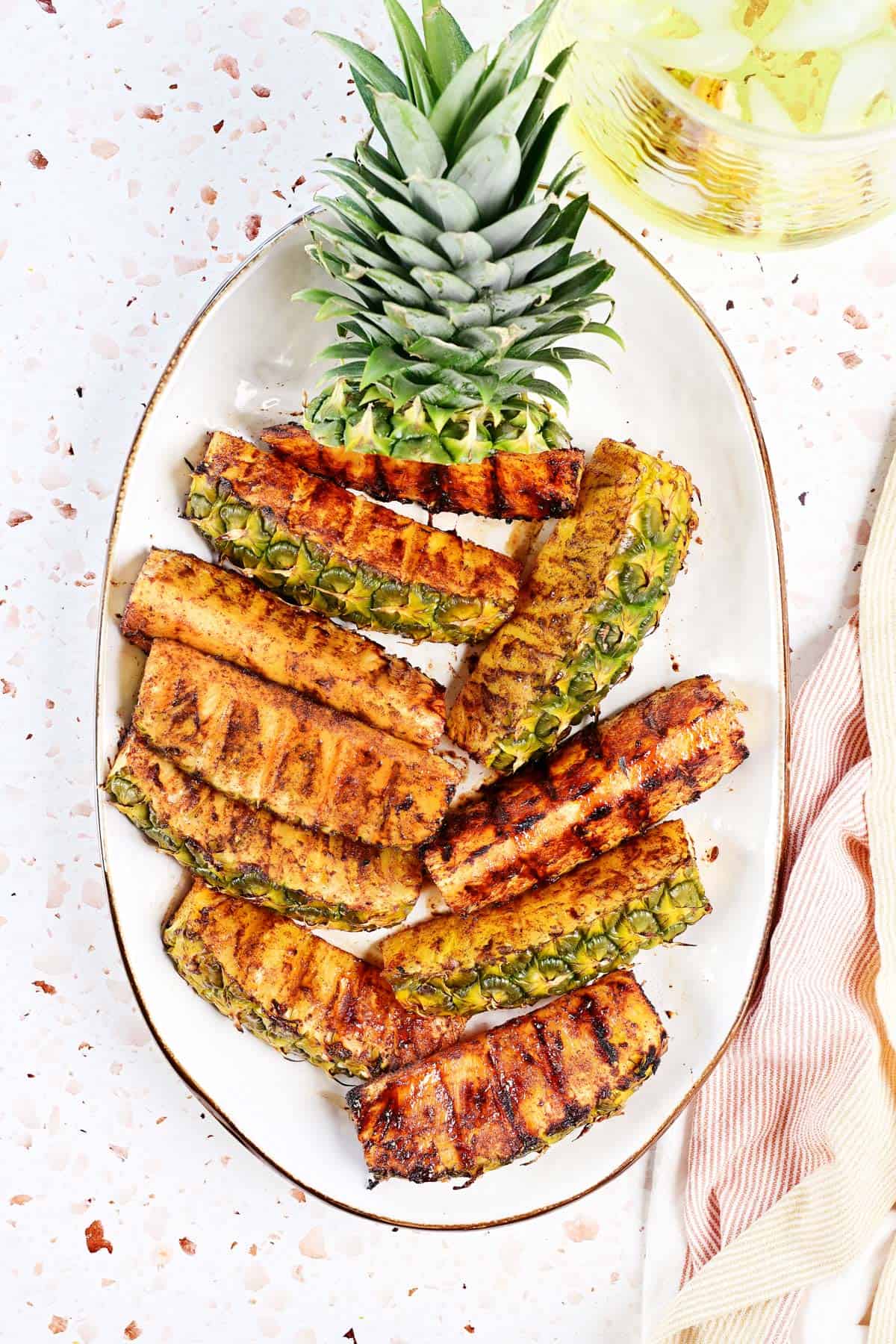 Grilled pineapple platter with a pitcher of lemonade.