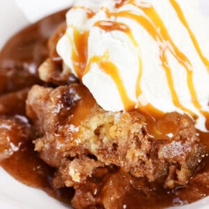 Slow cooker apple dump cake with ice cream on top.
