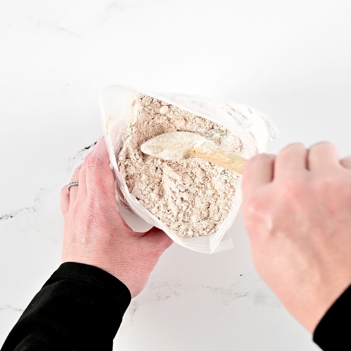 Mixing spices into cake mix.